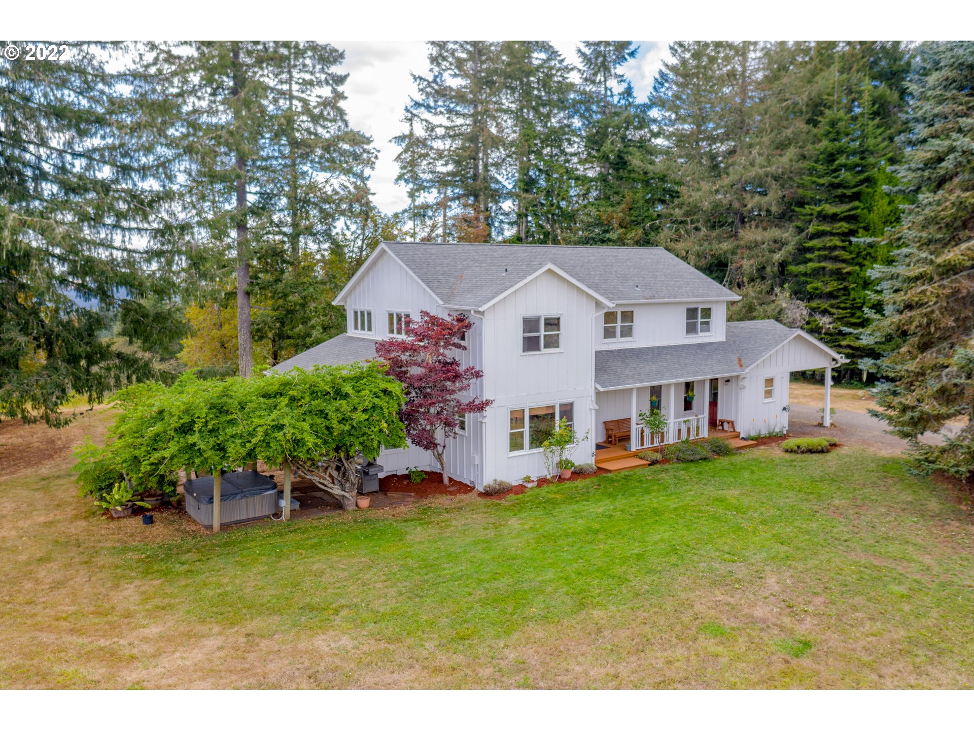 86835 R.R. Baker Road Springfield, OR 97478 - Photo 1 of 32 a front view of a house with a garden and trees