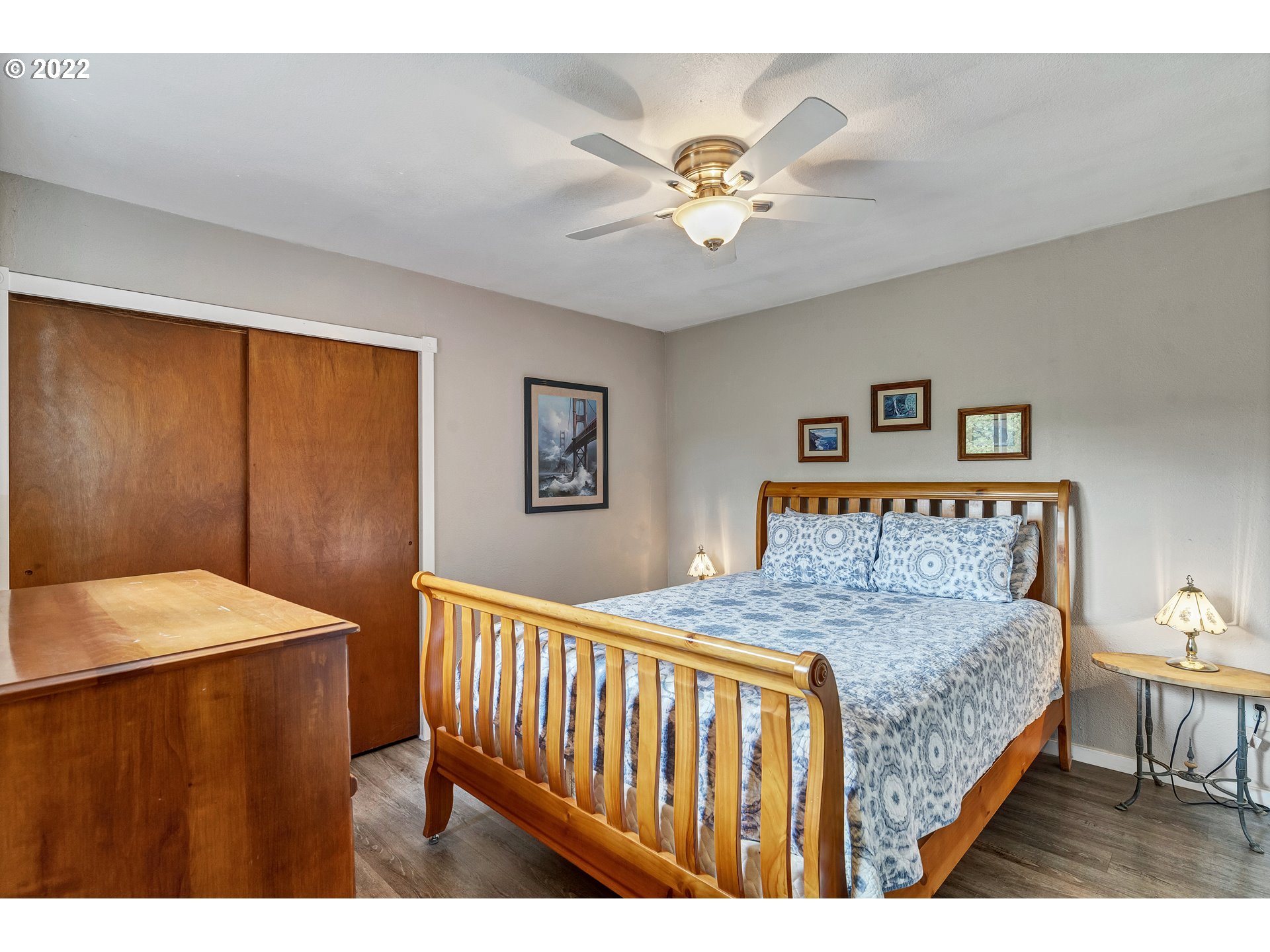 86835 R.R. Baker Road Springfield, OR 97478 - Photo 28 of 32 a bedroom with a bed and a chandelier
