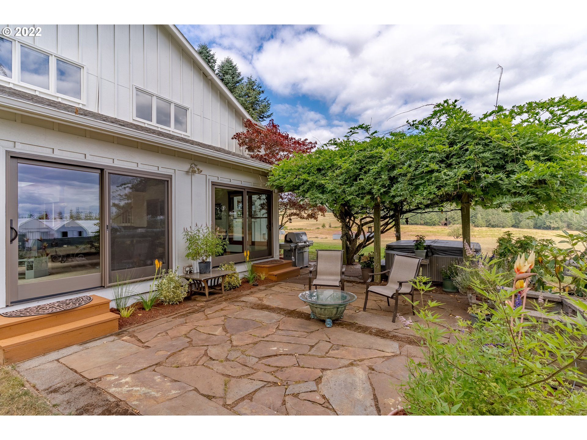 86835 R.R. Baker Road Springfield, OR 97478 - Photo 7 of 32 a backyard of a house with yard and outdoor seating