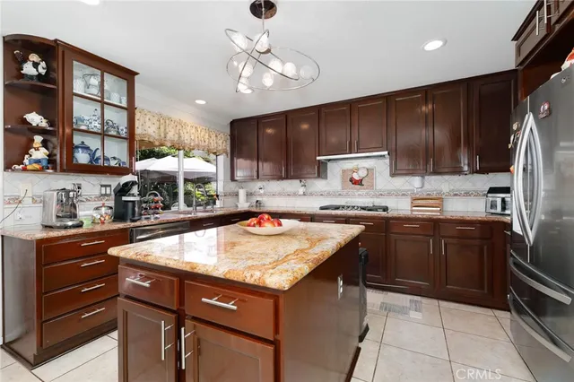 a kitchen with a sink stove and refrigerator