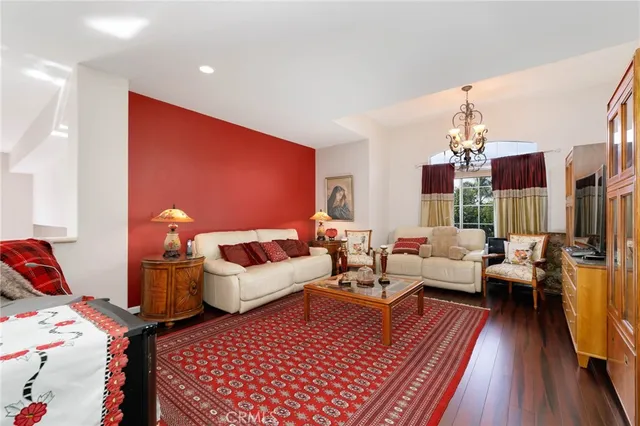 a living room with furniture fireplace and flat screen tv