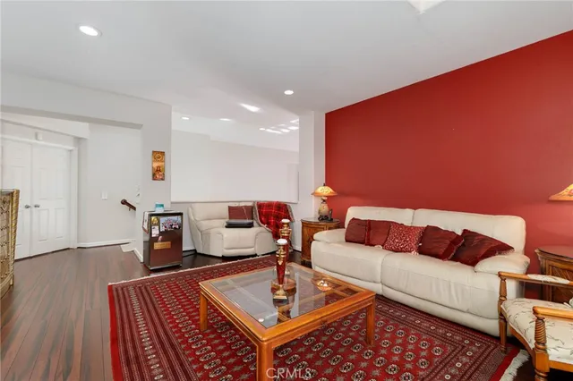 a living room with furniture and a rug