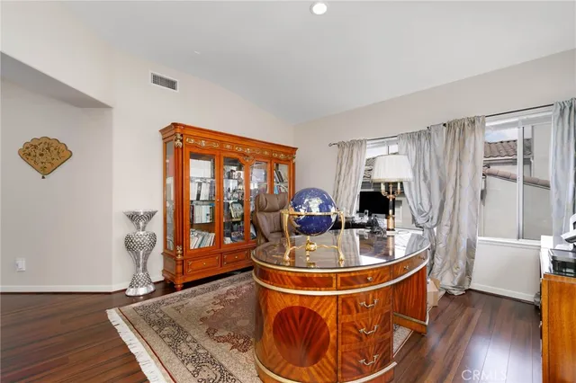 a room with wooden floor and glass door