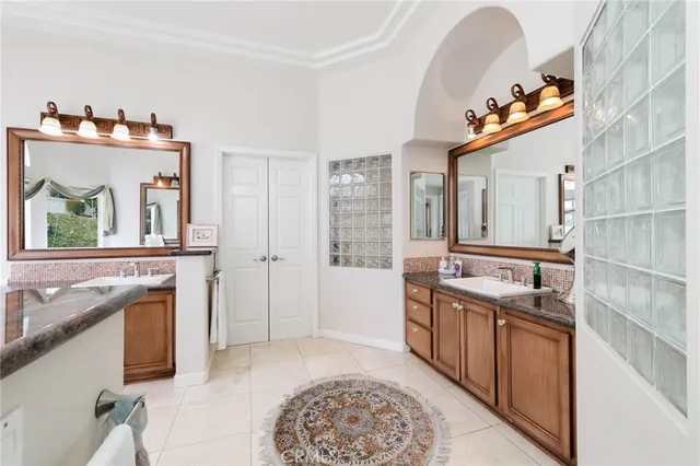 a spacious bathroom with a sink a mirror and a shower