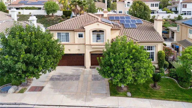 a view of a house with a yard and plants