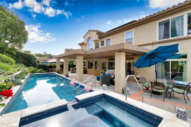 an aerial view of a house with outdoor space