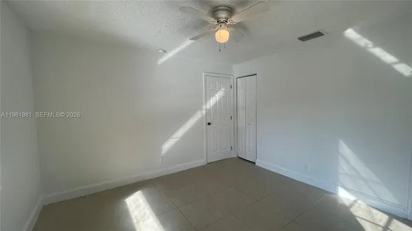 a view of a big room with carpet