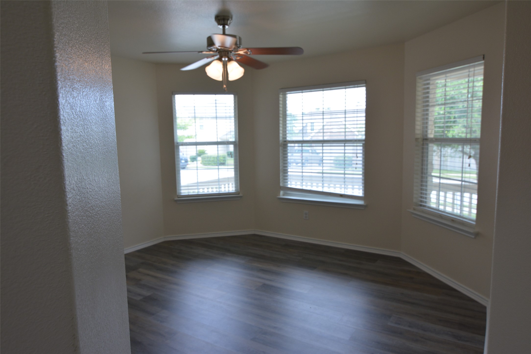 1303 Horseshoe Ranch Drive Leander, TX 78641 - Photo 18 of 26 Ample natural illumination streams into this room, highlighting the clean lines of the walls and flooring.