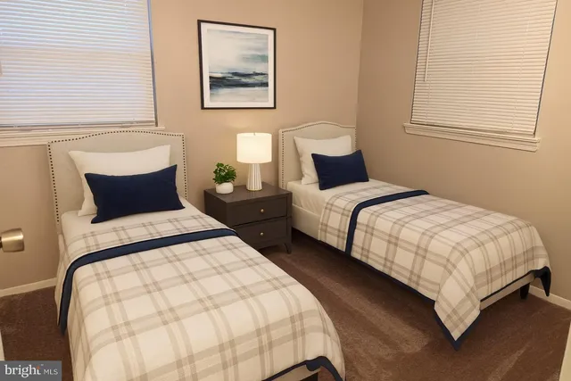 a bedroom with bed and a window