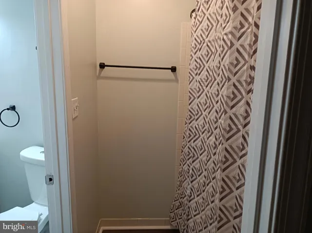 a bathroom with a shower and a door