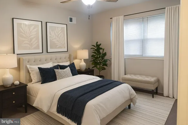 a bedroom with a bed and a window