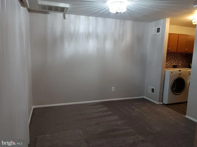a view of a storage & utility room with a fireplace