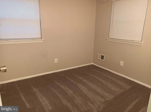 a view of a room that has a window