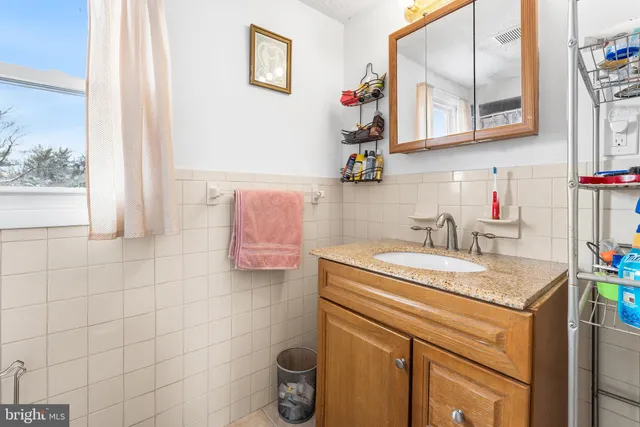 a white toilet sitting next to a shower curtain