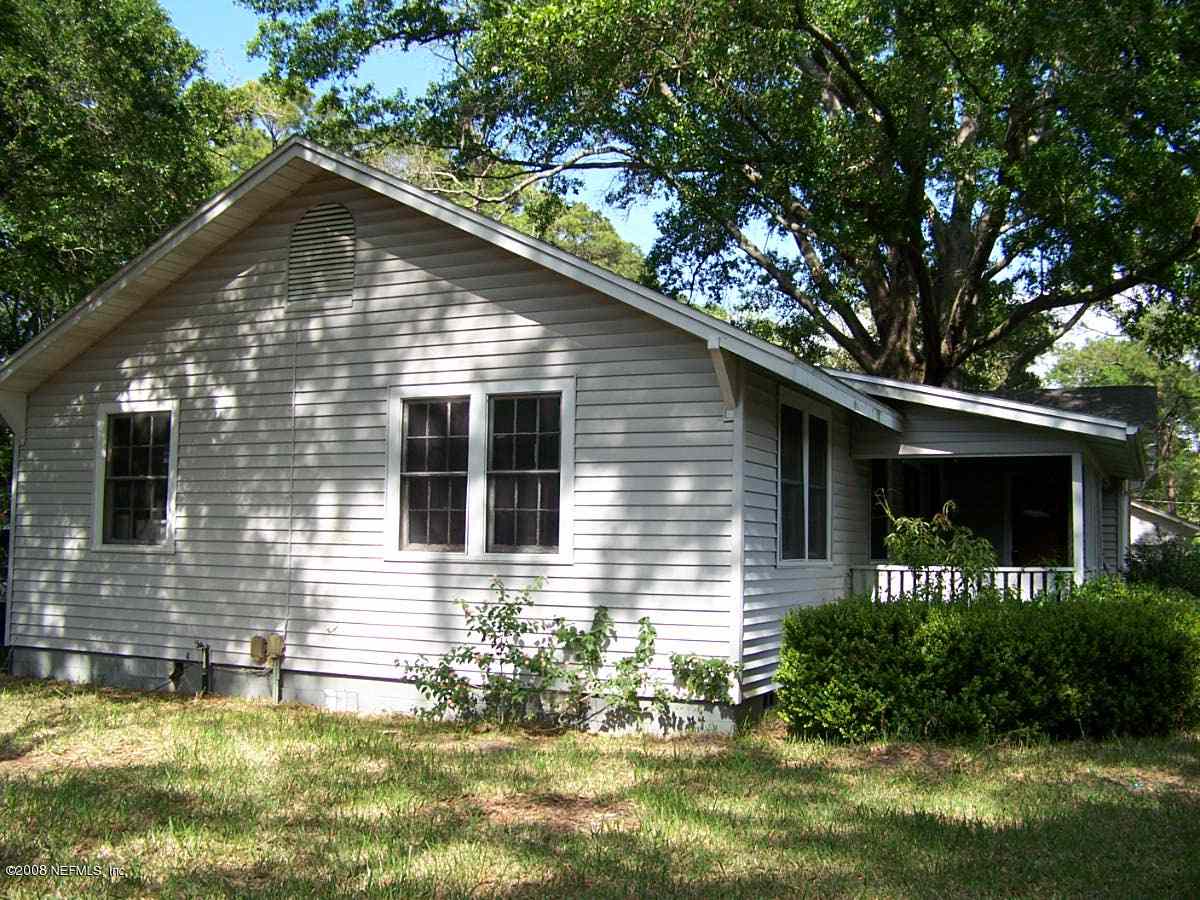 1133 Angus Street Jacksonville, FL 32208 - Photo 1 of 2 a front view of house with yard and outdoor seating