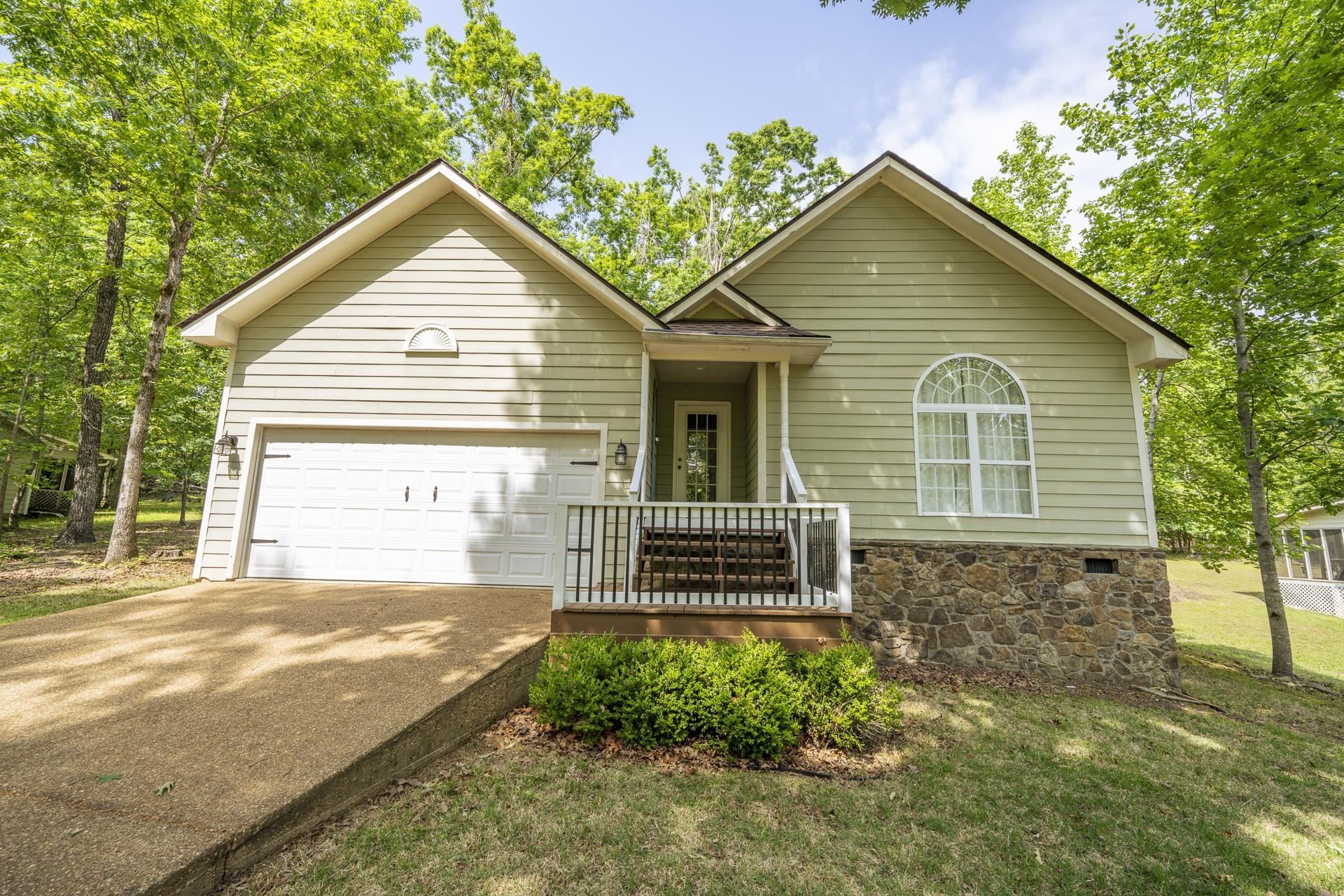 100 Masters Court Counce, TN 38326 - Photo 2 of 28 a front view of a house with a garden