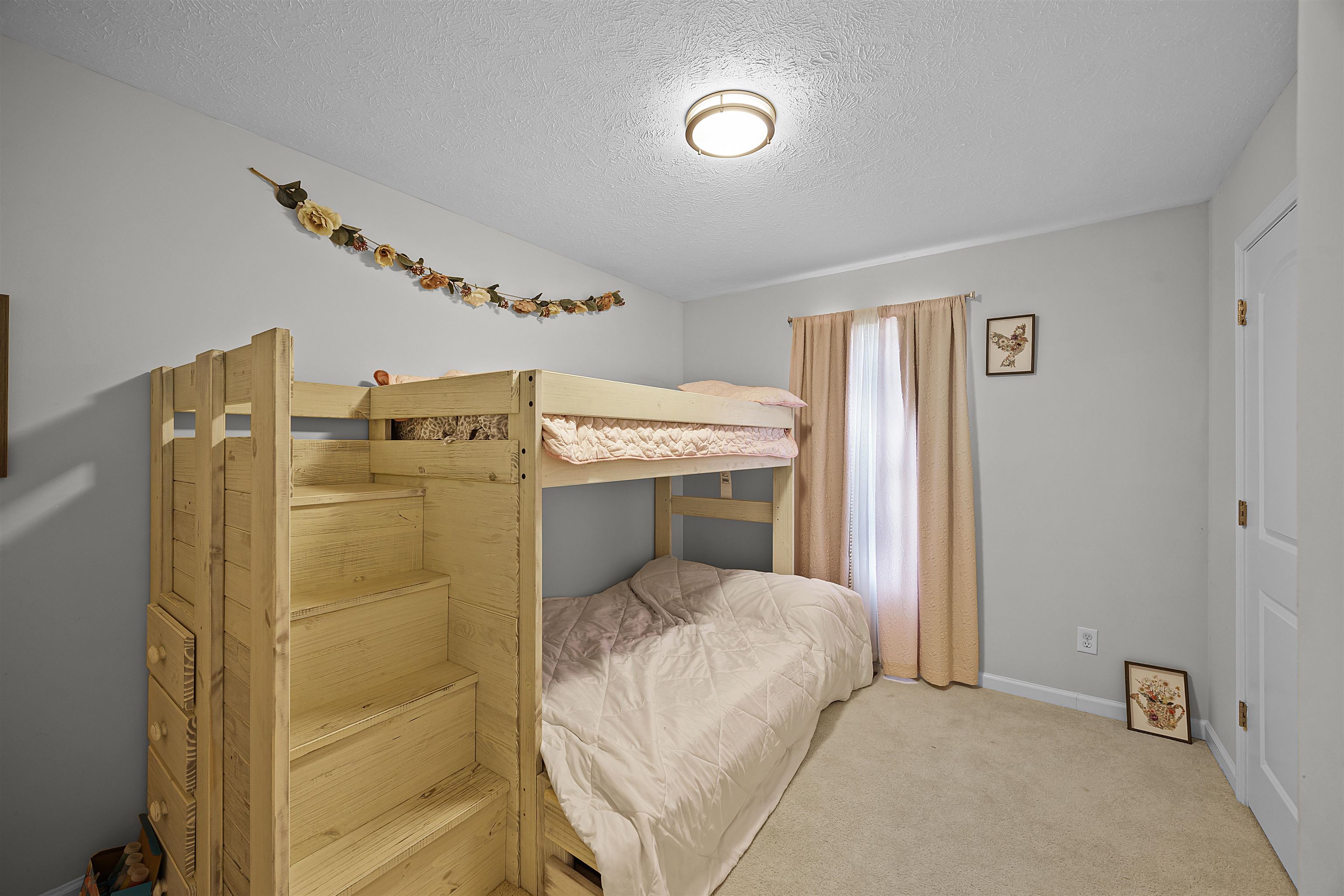 100 Masters Court Counce, TN 38326 - Photo 26 of 28 a bedroom with a bed and a chandelier