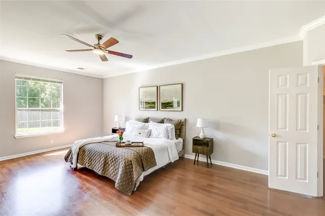 a bedroom with bed and window