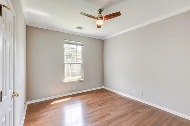 a view of a room with wooden floor