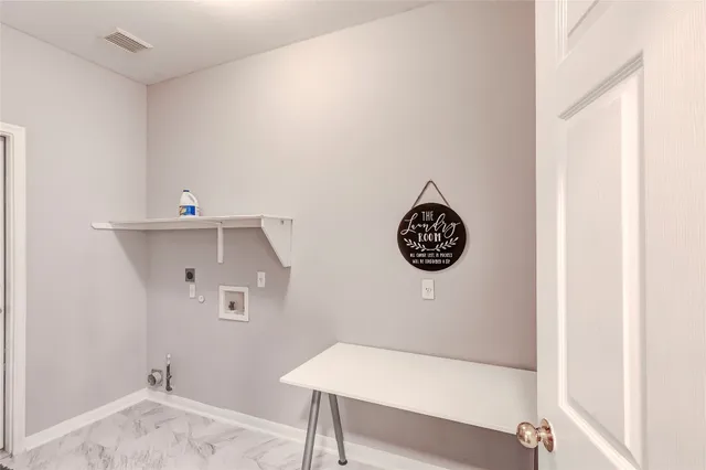 a bathroom with a granite countertop sink mirror and toilet