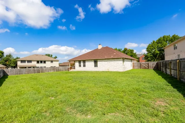 a view of a yard in front of a house with a yard