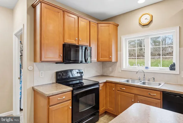 a bed room with a bed and a refrigerator