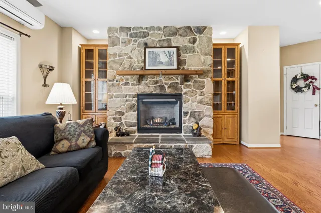 a bedroom with furniture and a wooden floor