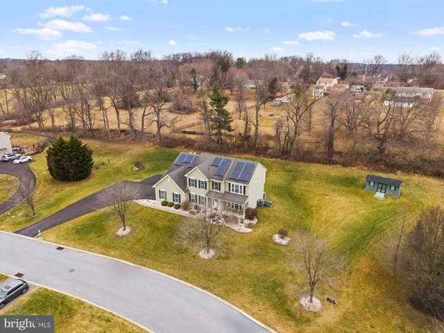 a view of a swimming pool with an outdoor seating