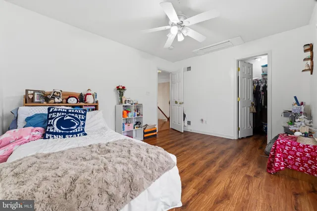 a bathroom with a granite countertop toilet and a shower