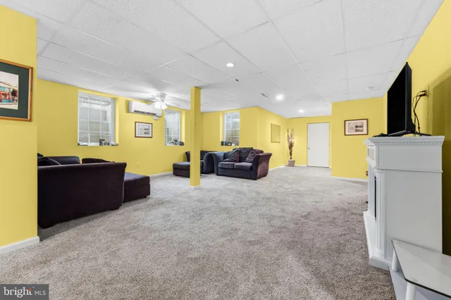 a view of a house with a backyard and sitting area