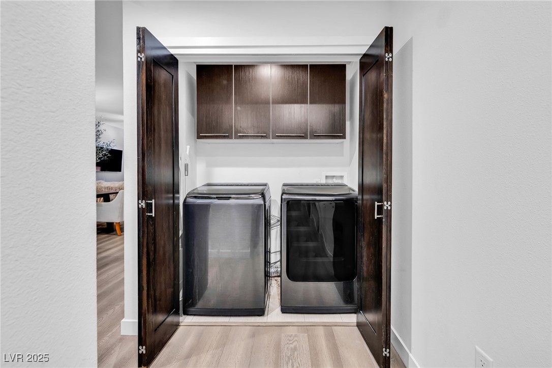 8925 West Flamingo Road, Unit 201 Las Vegas, NV 89147 - Photo 23 of 47 Laundry closet with designer matching machines