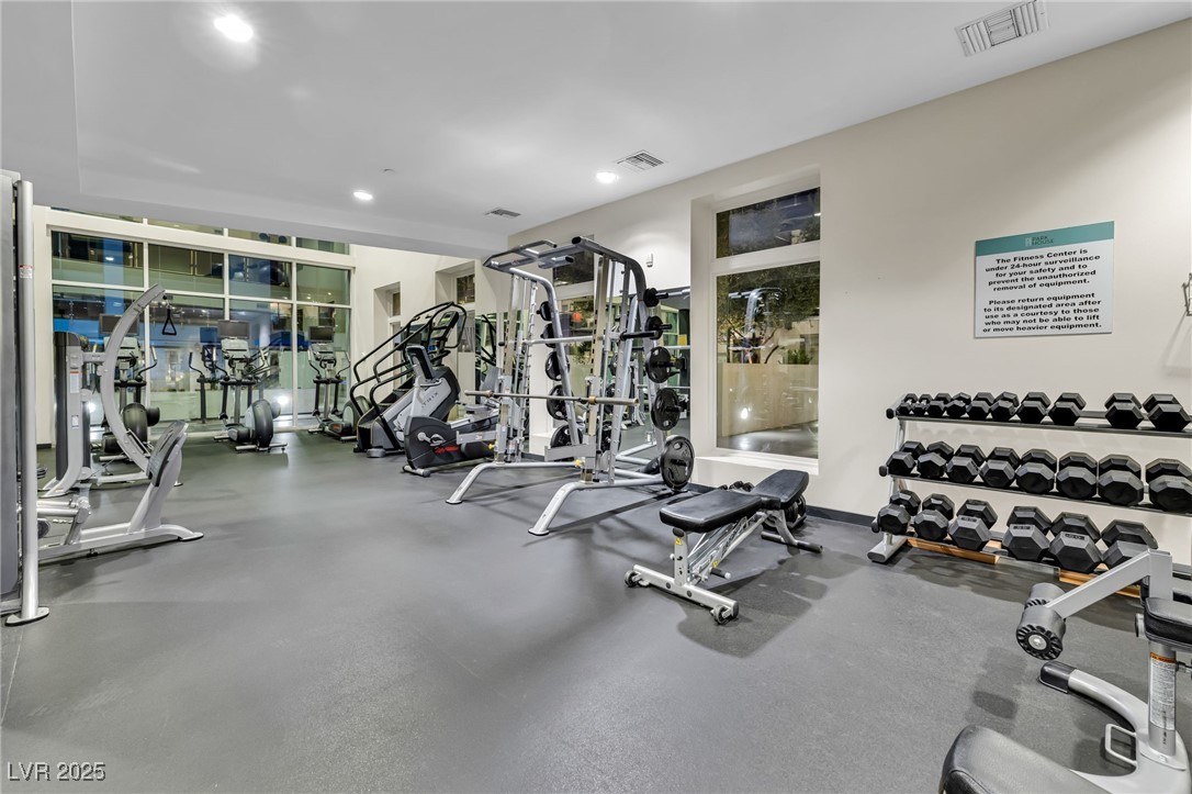 8925 West Flamingo Road, Unit 201 Las Vegas, NV 89147 - Photo 30 of 47 First floor fitness center looks out over the pool and is well appointed