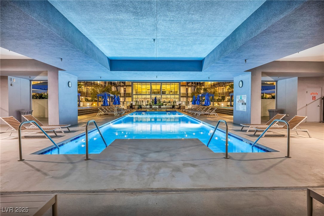 8925 West Flamingo Road, Unit 201 Las Vegas, NV 89147 - Photo 38 of 47 Indoor and outdoor hollywood style pool with cabanas