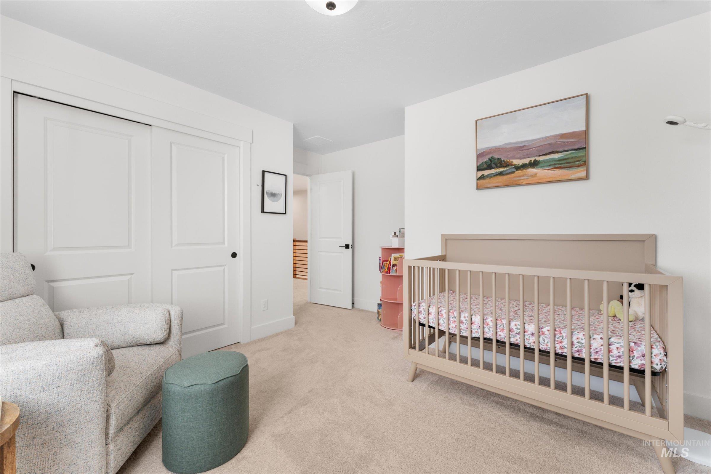 2172 Savoy Court Middleton, ID 83644 - Photo 24 of 46 A versatile room featuring a bold accent wall with vertical paneling, plush carpeting, and a window with blinds