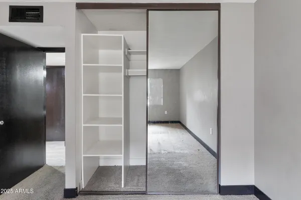 a bathroom with a mirror and a sink