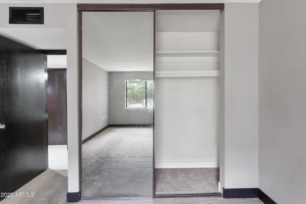a bathroom with a mirror and a sink