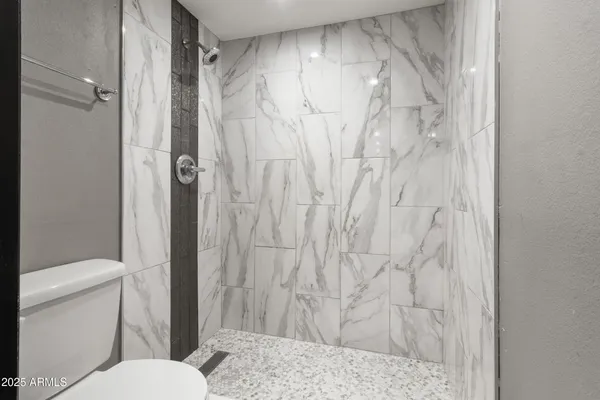 a kitchen with a refrigerator and a sink