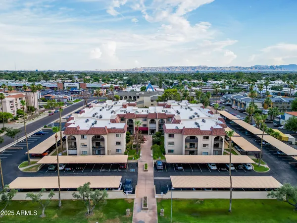 a view of a building with a yard