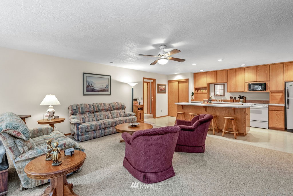 650 Frank Smith Road Toutle, WA 98649 - Photo 21 of 37 a living room with furniture kitchen view and a chandelier