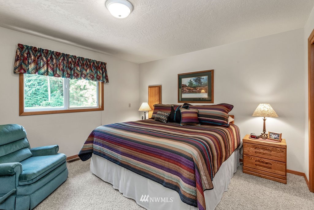 650 Frank Smith Road Toutle, WA 98649 - Photo 23 of 37 a bedroom with bed and a window