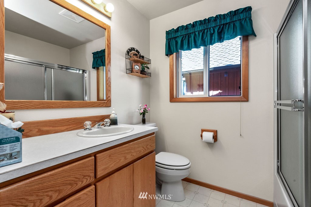 650 Frank Smith Road Toutle, WA 98649 - Photo 24 of 37 a bathroom with a sink a toilet and a mirror