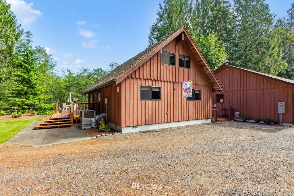 650 Frank Smith Road Toutle, WA 98649 - Photo 25 of 37 a view of a house with backyard and trees