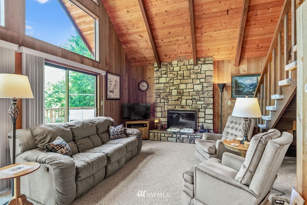 650 Frank Smith Road Toutle, WA 98649 - Photo 26 of 37 a living room with furniture a fireplace and a large window