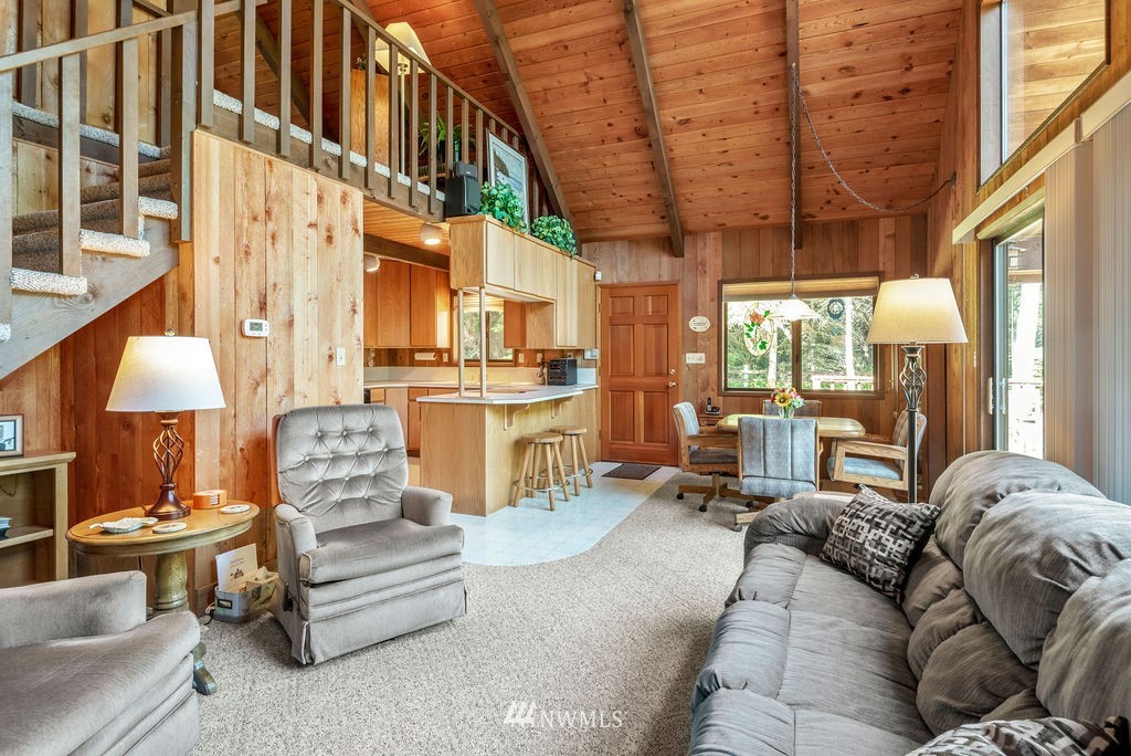 650 Frank Smith Road Toutle, WA 98649 - Photo 27 of 37 a living room with furniture a large window and a chandelier
