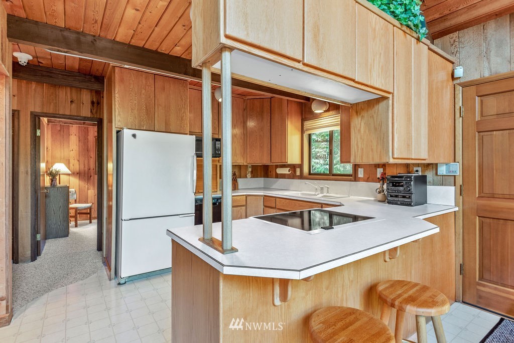 650 Frank Smith Road Toutle, WA 98649 - Photo 28 of 37 a kitchen with a refrigerator a sink and a cabinets
