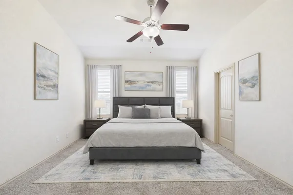 a bedroom with a large bed and a chandelier