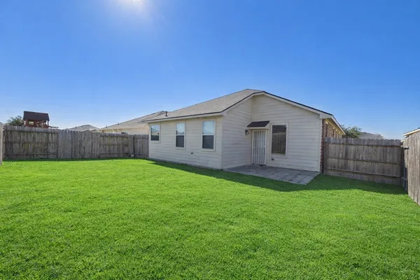 a backyard of a house with lots of green space