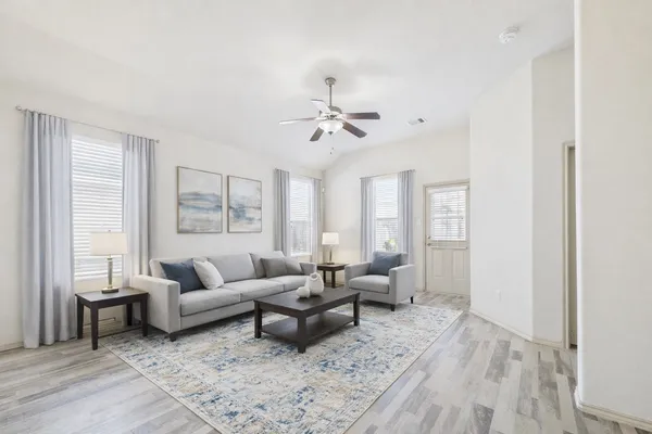 a living room with furniture and a large window