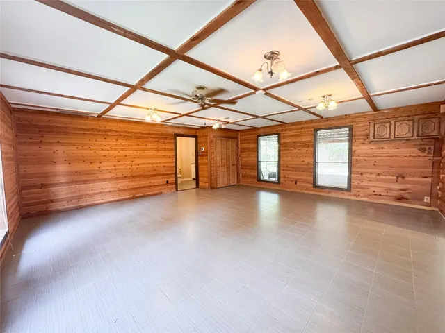 a view of a room with wooden walls