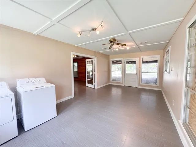 a view of livingroom with washer and dryer